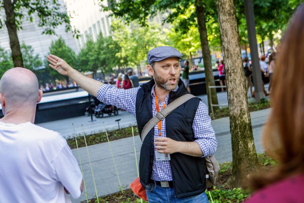 Guide pointing to sights at Ground Zero